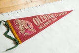 Olentangy Caverns pennant with Native American in headdress, red felt, yellow trim, green ties.