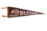 Vintage Buffalo felt pennant featuring a deep brown background with an off-white buffalo graphic and text.