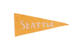 Antique Seattle felt pennant in mustard yellow with cream lettering, 3x7 inches.