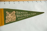 Vintage Benson Wild Animal Farm green felt pennant with tan tiger and text.