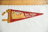 Red felt pennant with 'House of Seven Gables Salem, Mass.' text and colorful house illustration.