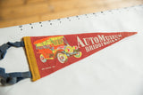 Vintage felt pennant's blue ties and yellow binding with partial antique car graphic.