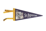Vintage 1960s St. Augustine blue felt pennant, yellow trim, cannon graphic. 5x12.