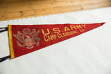 Yellow 'U.S. ARMY' lettering and crest on vintage red felt pennant.