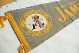 Vibrant yellow 'Jamboree' lettering on aged gray felt of 1964 Boy Scout pennant.