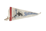 Vintage SeaWorld felt pennant with jumping orca, blue logo, and red edge, 5x11 inches.