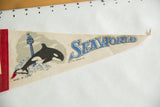 SeaWorld blue lettering on vintage felt pennant with subtle creasing.