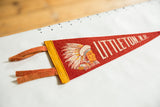 Red felt vintage Littleton, N.H. pennant showcasing Native American headdress.