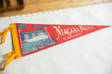 Vintage Niagara Falls Canada felt flag pennant, red with blue waterfall art and yellow ties.