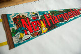 Vintage New Hampshire felt pennant with bold red text, skier, and ski lift imagery.