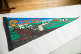 Angled view of the vintage Amish Country pennant showing the horse, buggy, and farm scene.