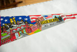 Angled view of the vintage Ellis Island pennant's colorful screen-printed illustration.