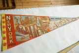 Vintage NYC felt flag pennant showing landmark collage and 'NEW YORK CITY' text.
