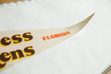 Beige felt pennant tip with red 'FLORIDA' text, light creasing, and pinhole.