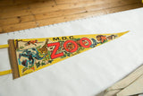 Detail of vintage MDC Zoo felt pennant featuring red ZOO lettering and wild animal illustrations.