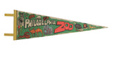 Green vintage Philadelphia Zoo felt pennant with colorful wild animal graphics.