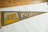 Faded 'PLYMOUTH MASS.' text on vintage green felt pennant.