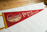Red felt vintage pennant with cream Howe Caverns lettering and Lodge illustration.