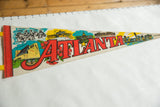 Vintage Atlanta felt pennant's left side featuring Stone Mountain and Omni illustrations.