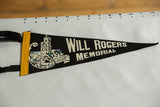 Close-up of the Will Rogers Shrine graphic and stitched yellow felt edge on the vintage pennant.