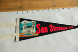 Detailed view of the colorful Hearst Castle graphic and stitched felt ties on the San Simeon pennant.