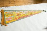 Angled view of vintage Chicago felt pennant, with colorful skyline and prominent red lettering.