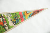 Pointed end of vintage felt pennant showing rainbow and Antique Auto Museum text.