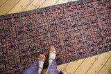 Detail of vintage Malayer rug runner, with navy and red Herati motif and narrow border.