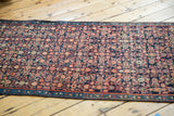 Vintage Malayer runner's navy, red Herati pattern, beige accents, and narrow banded border.