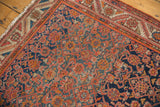 Vintage Malayer rug with intricate Herati motif in madder root red, cobalt blue, terracotta, and a geometric serrated border.