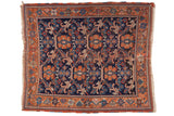 Antique Persian Afshar square rug, allover vinery and oversize floral motifs, indigo, rust, and blue tones.