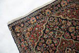 Intact plain woven end and secured side of a vintage Persian Sarouk collector rug.