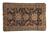 Vintage Hamadan rug, navy blue field with oversized medallions, terracotta and green motifs.