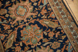 Vintage Hamadan rug border, showing floral motifs on antique ivory and secured selvage.