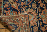 Vintage Hamadan rug corner, showing detailed navy, terracotta border, and secured overcast ends.