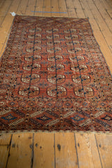 Antique Tekke rug corner with geometric elephant footprint gul motifs and professionally secured end.