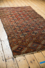 Fringe and geometric border patterns of an antique Tekke rug with low pile.