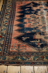 Vintage Malayer rug: worn navy and blush field, intricate wave and floral borders.