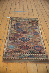 Antique Belouch runner's reinforced plain-woven kilim end with geometric border motifs.