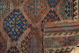 Antique Belouch runner's geometric gul motifs, low pile, and reinforced striped kilim end.