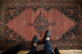 Vintage Malayer rug, blush rose abrashed field, serrated cobalt medallion, worn floral spandrels.