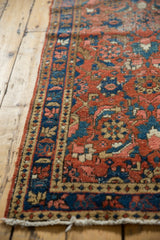 Vintage Heriz runner's original side cord selvage borders a low pile Herati motif.