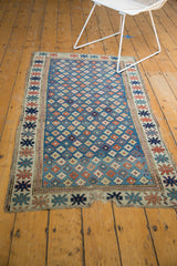 Antique hand-knotted Kuba runner: unusual blue field, geometric florals, perimeter tatter.