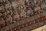 Malayer rug detail: charcoal, navy, cherry red alover boteh, localized foundation wear, intricate border.