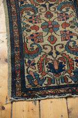 Antique Borchalou rug: rare ivory field, dramatic scrolling floral motifs, and tattered end.