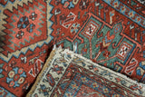 Hand-knotted vintage Karaja rug, showcasing tight foundation weave and end fringe with tatter.