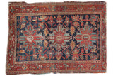 Fine vintage Heriz rug with triple medallion, curvilinear vinery, navy field, red border.