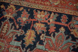 Vintage Heriz rug pattern detail with curvilinear vinery, palmettos in navy, red, green.