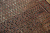 Antique Malayer carpet's repeating boteh motif, mostly even wear to knot heads, and geometric border in red and blue.