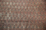 Blush and blue repeating boteh pattern on antique Malayer carpet with etched foundation.